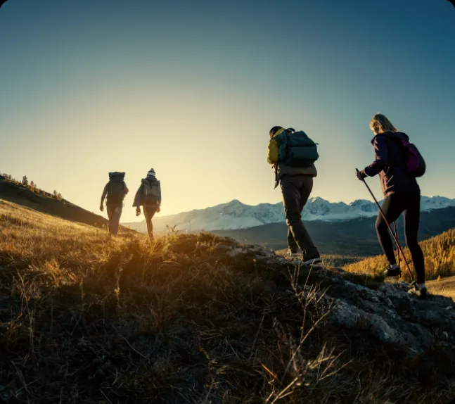 A small group hiking together in the mountains