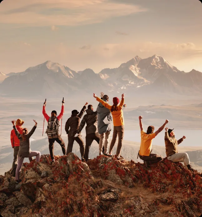 A joyful group celebrating in the mountains